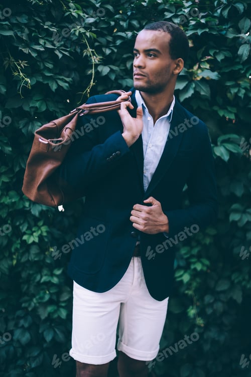 Preview: Confident In His Perfect Style. Handsome Young African Man In Smart Casual Wear Carrying Bag On