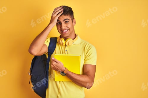 Preview: Indian Student Man Wearing Backpack Headphones Notebook Over Isolated Yellow Background Stressed