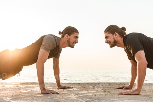 Preview: Two Twin Brothers Doing Exercises At The Beach Together, Doing Push-Ups