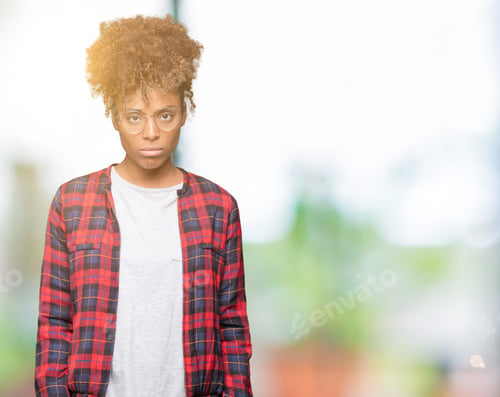 Preview: Beautiful Young African American Woman Wearing Glasses Over Isolated Background Depressed And Worry