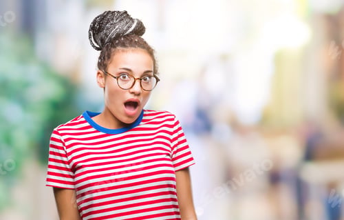 Preview: Young Braided Hair African American Girl Wearing Glasses Over Isolated Background Afraid And