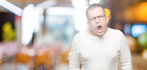 Preview: Middle Age Arab Man Wearing Glasses Over Isolated Background In Shock Face, Looking Skeptical And