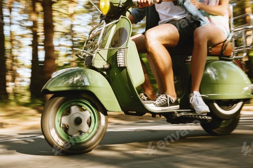 Preview: Cropped Image Of Young Bearded Man On Scooter With Girlfriend Outdoors.