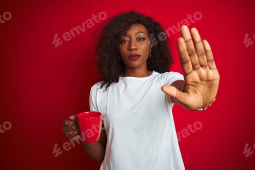 Preview: Young African American Woman Drinking Cup Of Coffee Over Isolated Red Background With Open Hand