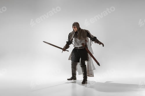Preview: Brave Armored Knight With Professional Weapon Fighting Isolated On White Studio Background