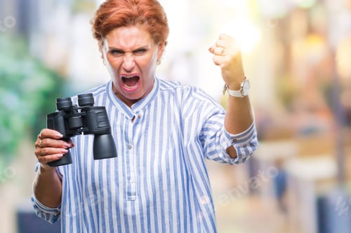 Preview: Senior Caucasian Woman Looking Through Binoculars Over Isolated Background Annoyed And Frustrated
