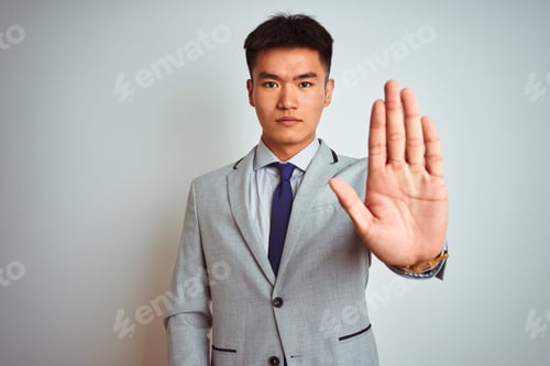 Preview: Asian Chinese Businessman Wearing Grey Jacket And Tie Standing Over Isolated White Background Doing