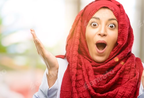 Preview: Young Arab Woman Wearing Hijab Happy And Surprised Cheering Expressing Wow Gesture