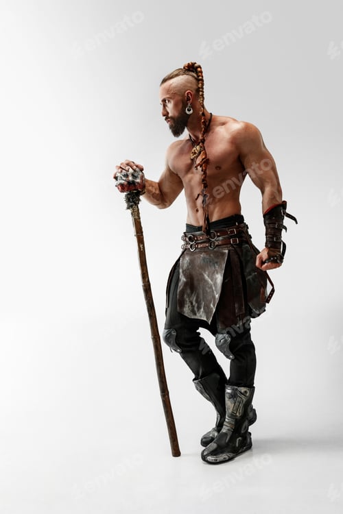 Preview: Serious Long Hair And Muscular Male Model In Leather Viking'S Costume With The Big Mace Cosplaying