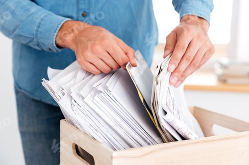 Preview: Close Up Portrait Of Man Hands Looking For Documents In Stack Of Folders On The Office Table
