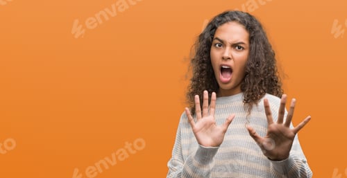 Preview: Beautiful Young Hispanic Woman Wearing Stripes Sweater Afraid And Terrified With Fear Expression