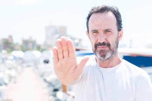 Preview: Handsome Middle Age Man In Marina With Open Hand Doing Stop Sign With Serious And Confident