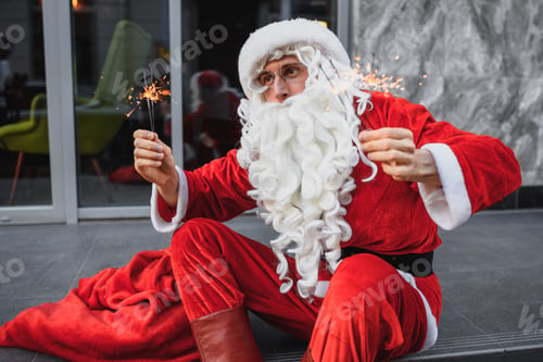 Preview: Santa Claus Holds Sparklers In Her Hands