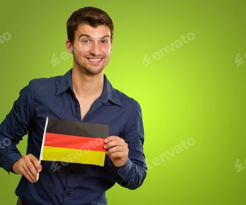 Preview: A Young Man Holding A German Flag On Green Background