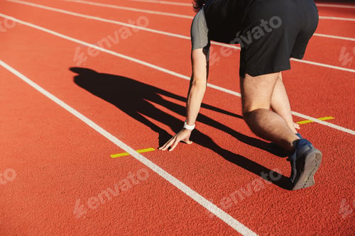Preview: Motivated Young Sportsman Getting Ready To Run At The Stadium