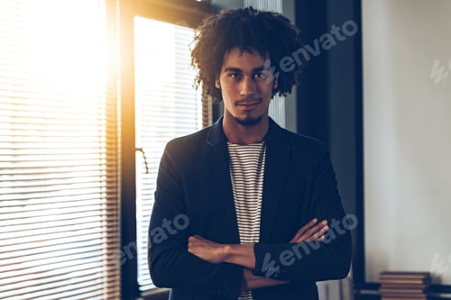 Preview: Confident Young Man in Blazer by Bright Window