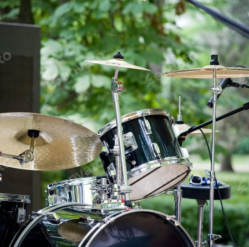 Preview: Getting Ready To Perform, A Rock Drum Set Up Outdoors, With Loudspeaker In The Back.