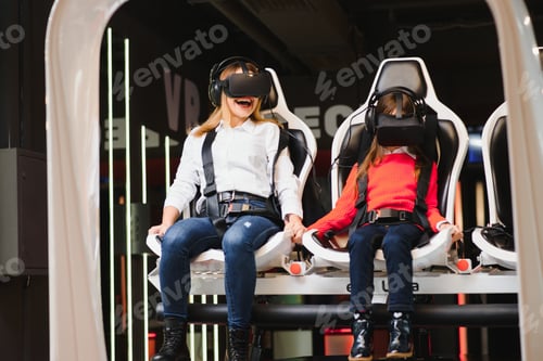 Preview: Entertainment. Cheerful Fair-Haired Young Mother And Daughter Wearing Vr Headset And Entertaining.