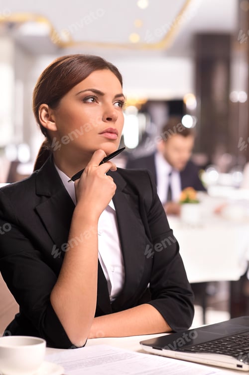 Preview: In Search Of New Business Ideas. Thoughtful Young Woman In Formalwear Holding Hand On Chin And
