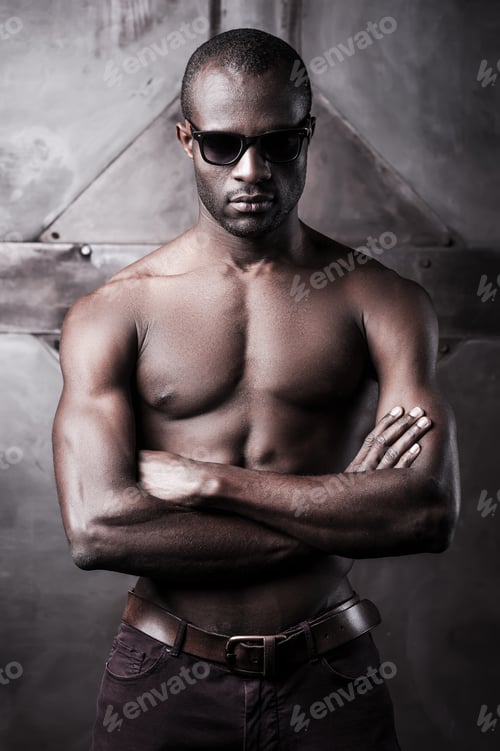 Preview: Cool Handsome. Handsome Young Shirtless African Man In Sunglasses Keeping Arms Crossed
