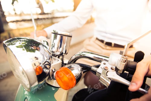 Preview: Closeup Portrait Of A Man Riding On Scooter Outdoors