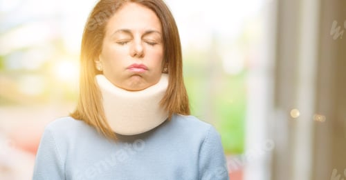 Preview: Injured Woman Wearing Neck Brace Collar With Sleepy Expression, Being Overworked And Tired