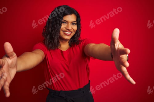 Preview: Beautiful Transsexual Transgender Woman Wearing T-Shirt Over Isolated Red Background Looking At The