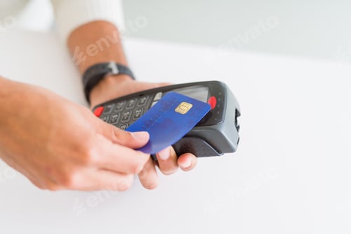 Preview: Close Up Of Man Hands Holding Point Of Sale Terminal, Dataphone For Shopping Paying Using Credit