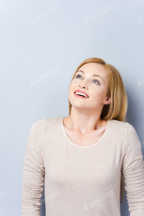 Preview: So Exited! Beautiful Young Blond Hair Women Holding Smiling And Looking Away While Standing Against