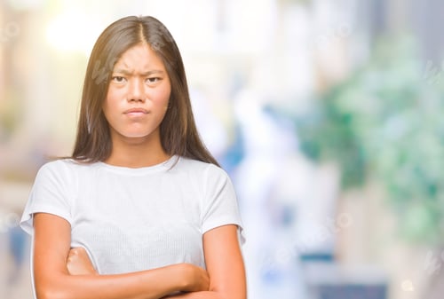 Preview: Young Asian Woman Over Isolated Background Skeptic And Nervous, Disapproving Expression On Face