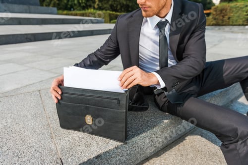 Preview: This Is Exactly What I Need. Close-Up Of Confident Young Man In Formalwear Taking The Documents