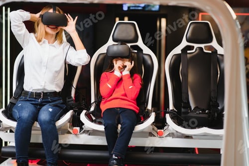 Preview: Entertainment. Cheerful Fair-Haired Young Mother And Daughter Wearing Vr Headset And Entertaining.