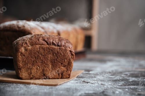 Preview: Image Of Bread With Flour On Dark Wooden Table Background At Bakery