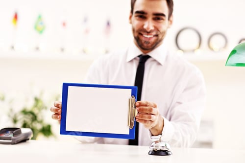 Preview: Picture Showing Happy Receptionist Working In Hotel