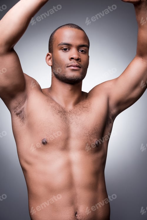 Preview: Feeling Confident In His Fit Body. Young Shirtless African Man Keeping Arms Raised And Smiling
