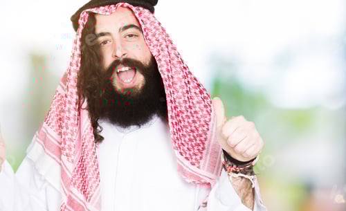 Preview: Arabian Business Man With Long Hair Wearing Traditional Keffiyeh Scarf Success Sign Doing Positive