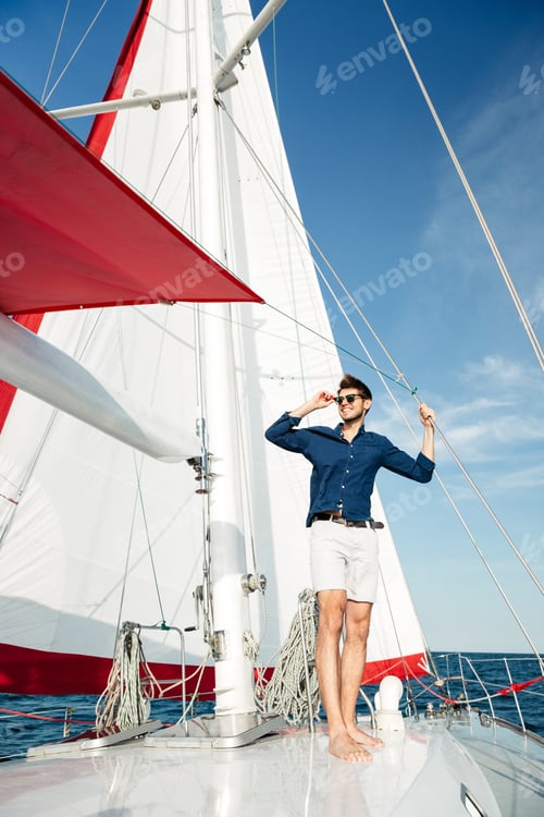 Preview: Young Bearded Man Standing On A Yacht And Looking At The Horizon