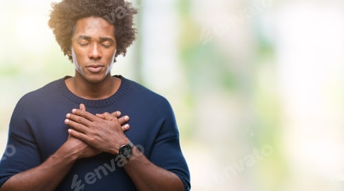 Preview: Afro American Man Over Isolated Background Smiling With Hands On Chest With Closed Eyes And