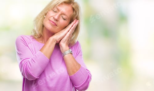 Preview: Middle Age Blonde Woman Over Isolated Background Sleeping Tired Dreaming And Posing With Hands
