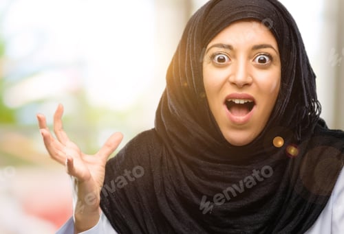 Preview: Young Arab Woman Wearing Hijab Terrified And Nervous Expressing Anxiety And Panic Gesture