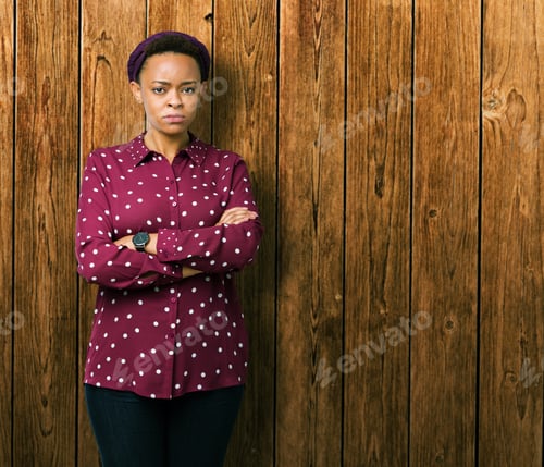 Preview: Beautiful Young African American Woman Wearing Head Scarf Over Isolated Background Skeptic And