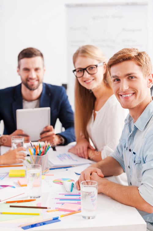 Preview: Confident And Creative. Group Of Cheerful Business People In Smart Casual Wear Sitting Together At