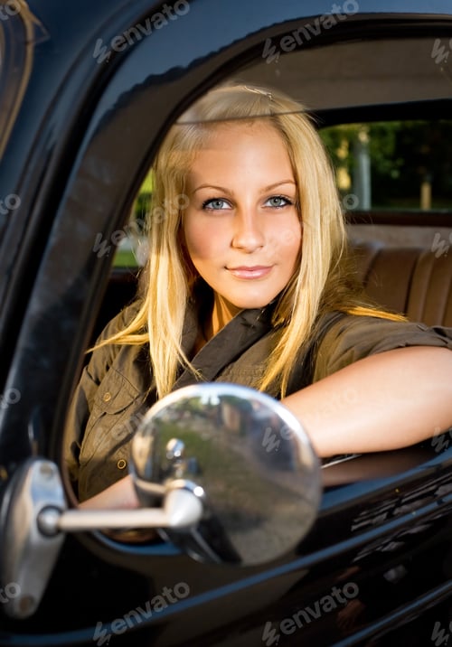 Preview: Beautiful Young Blonde Posing With Black Vintage Car.