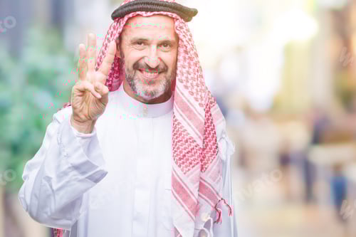 Preview: Senior Arab Man Wearing Keffiyeh Over Isolated Background Showing And Pointing Up With Fingers