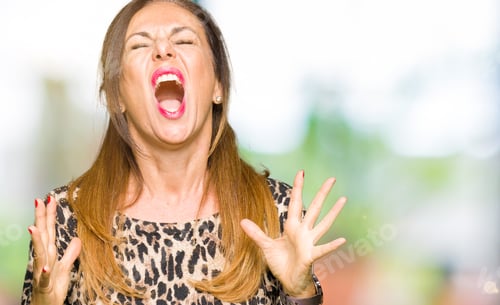 Preview: Beautiful Middle Age Woman Wearing Leopard Animal Print Dress Crazy And Mad Shouting And Yelling