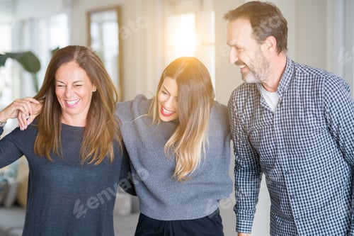 Preview: Beautiful Family Together. Mother, Father And Daughter Smiling And Hugging With Love At Home.