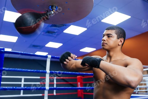 Preview: Handsome Boxer Exercising With The Speed Bag