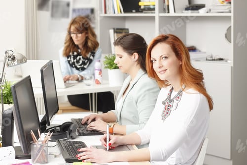 Preview: Professional Women Working Together in Modern Office