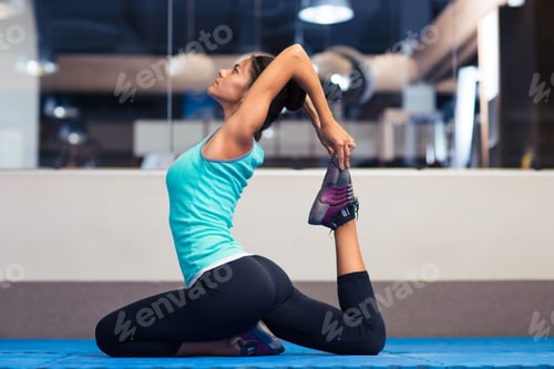 Preview: Portrait Of A Young Woman Stretching In Gym