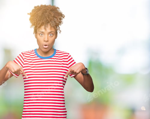 Preview: Beautiful Young African American Woman Over Isolated Background Pointing Down With Fingers Showing
